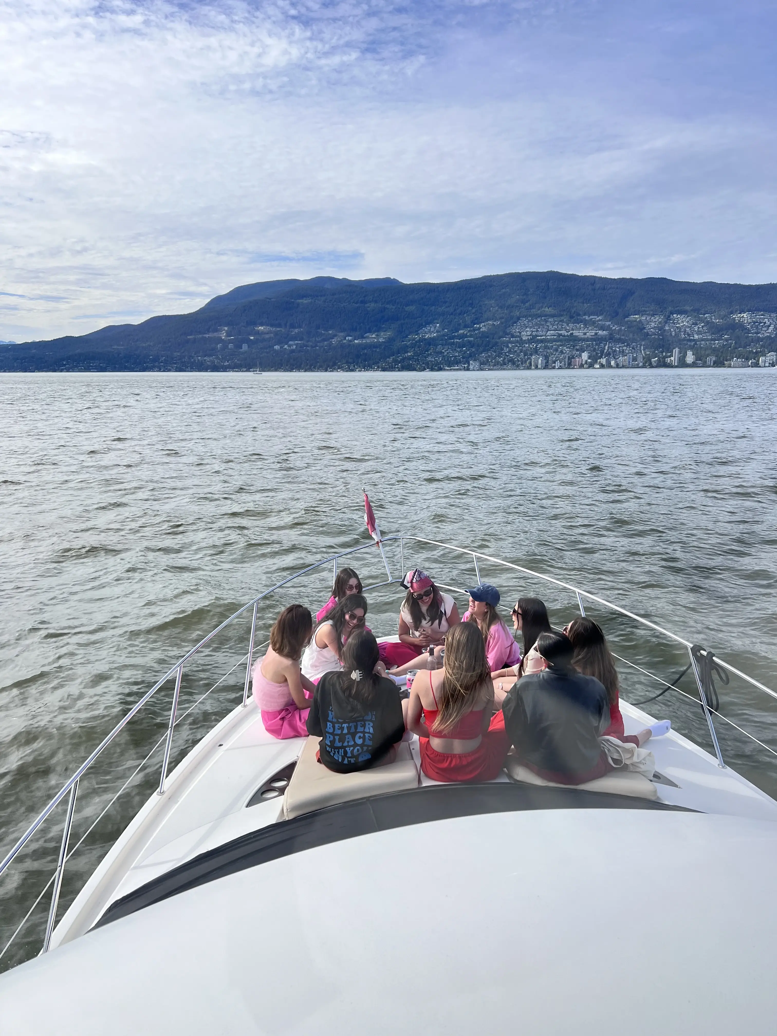 Guests on the bow cruising toward the North Shore mountains
